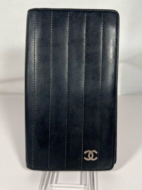 1124: Chanel Vertical Quilted Black Leather Long Wallet